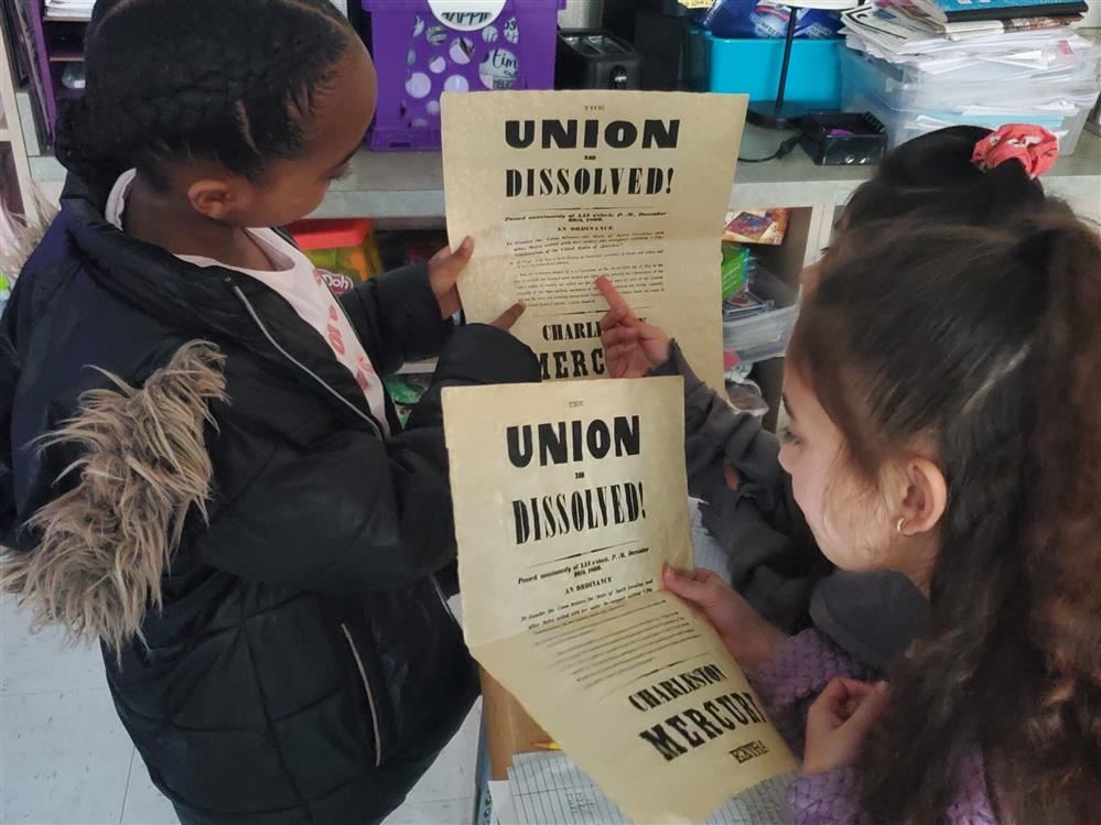 Students look at Civil War artifacts